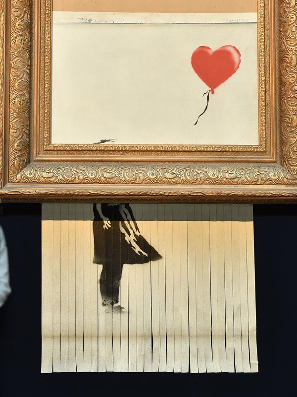 Sebuah lukisan karya seniman Bansky berjudul 