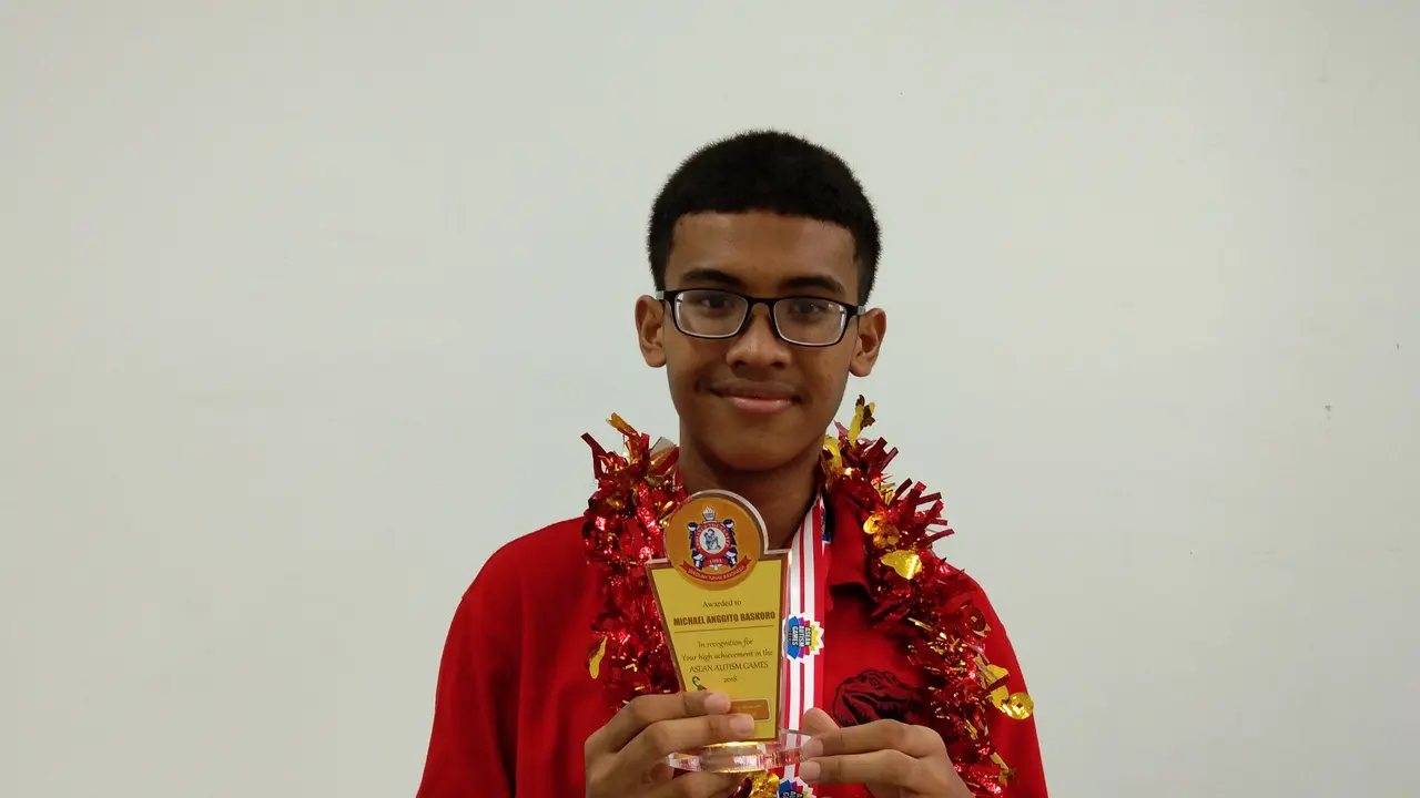 Michael Anggito Baskoro, peraih emas dan perunggu di dua cabang olahraga ASEAN Autism Games 2018 (Giovani Dio Prasasti/Liputan6.com)