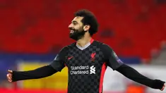 Pemain Liverpool Mohamed Salah merayakan setelah mencetak gol ke gawang RB Leipzig pada leg pertama babak 16 besar Liga Champions di Stadion Ferenc Puskas, Budapest, Hungaria, Selasa (16/2/2021). Liverpool menang 2-0. (AP Photo/Laszlo Balogh)