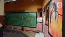 Mural menghiasi tembok rumah warga RT 02/RW 07 Kampung Warna-warni, Kelurahan Pengadegan, Jakarta Selatan, Selasa (10/12/2019). Mural di kampung ini dibuat dari dana swadaya warga setempat. (merdeka.com/Imam Buhori)