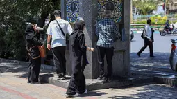 Media Iran melaporkan pada Senin (21/7/2025), sejumlah kota mengeluarkan peringatan cuaca level kuning. (Foto oleh AFP)