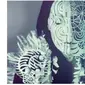 Kombinasi papercut dan bodypainting (Sumber: Boredpanda)