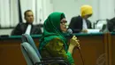 Susi Tur Andayani telah mengakui kesalahannya dan menyesal atas semua perbuatan yang dilakukan. Senin (19/5/14) (Liputan6.com/Miftahul Hayat)
