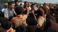 Kamis (14/8/14), Gubernur DKI Jakarta Joko   Widodo menghadiri upacara HUT ke-53 Gerakan   Pramuka di pelataran Monas, Jakarta,   (Liputan6.com/Herman Zakharia) 