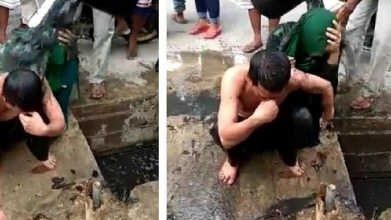 Pasangan disiram air selokan (Sumber: Instagram.com/makassar_iinfo)