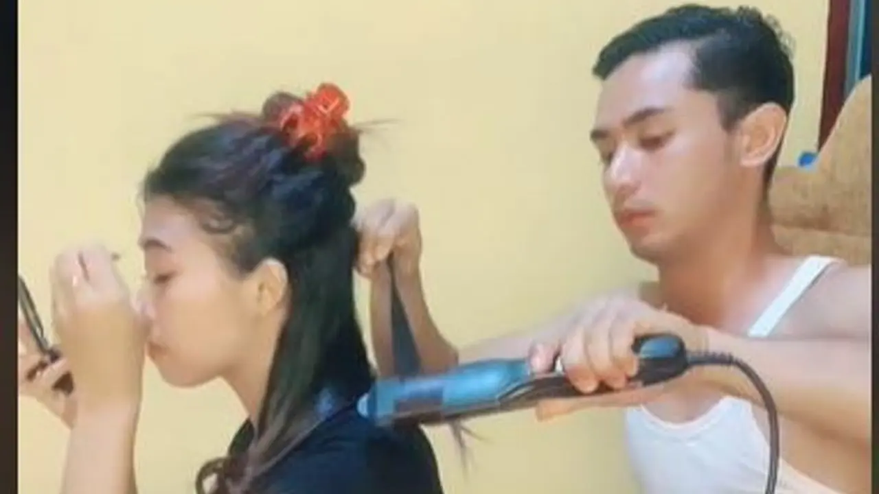 Aksi Pria Bantu Catok Rambut Istri dengan Telaten Tuai Pujian Warganet