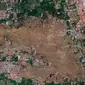 Citra satelit 1 Oktober 2018 yang disediakan oleh DigitalGlobe ini menunjukkan lingkungan Petobo di Palu, Indonesia, setelah gempa bumi dan tsunami berikutnya menyebabkan kerusakan dan likuifaksi yang besar di desa. (DigitalGlobe, perusahaan Maxar via AP)