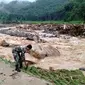 Tim gabungan berupaya evakuasi dan mencari satu keluarga yang dinyatakan hilang diduga terseret banjir bandang di Kabupaten Labuhanbatu Utara (Labura), Sumatera Utara hingga hari ini, Minggu (29/12/2019). (Dok Badan Nasional Penanggulangan Bencana/BNPB)