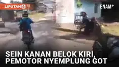 Entah apa yang ada dalam benak pemotor berikut. Terekam ia menyalakan lampu sein ke kanan, namun justru belok ke kiri. Ia malah jatuh ke got di tepi kanan usai belok.