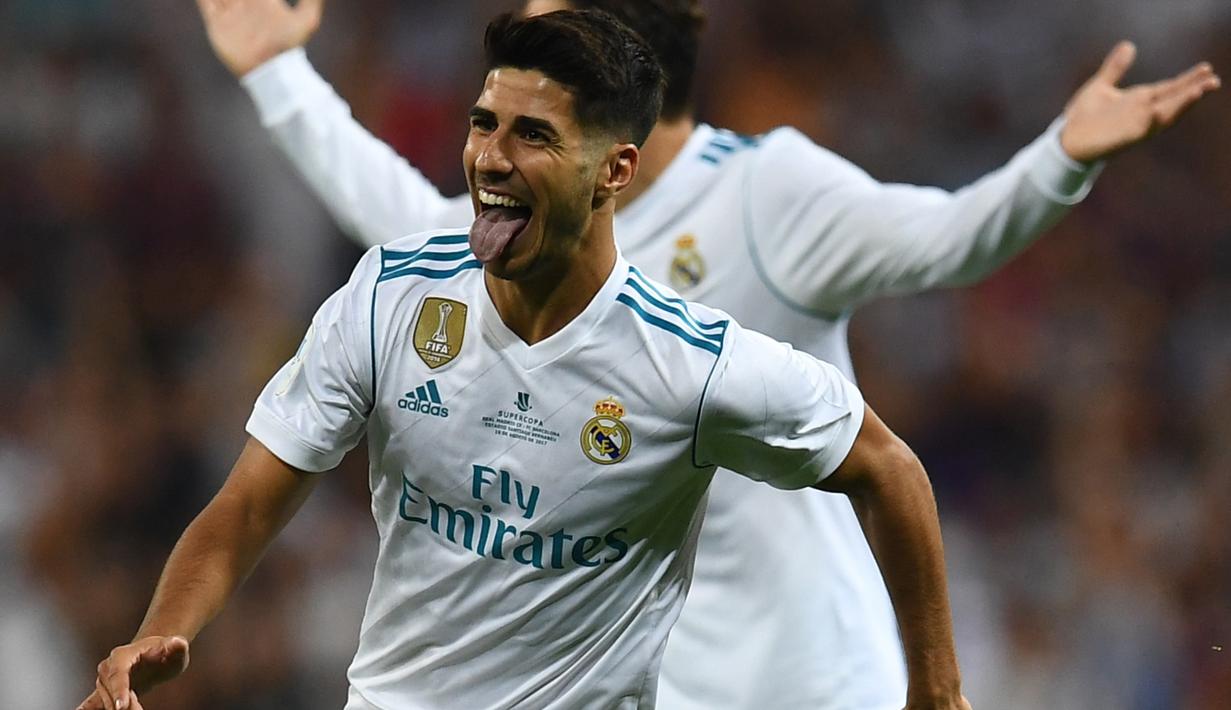 Gelandang Real Madrid, Marco Asensio berada pada peringkat kedua daftar top scorer Los Blancos, Asensio total mencetak tujuh gol di semua leel kompetisi. (AFP/Gabriel Bouys)