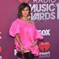 Penyanyi Agnez Mo berpose saat menghadiri iHeartRadio Music Awards 2019 di Los Angeles, California, AS, Kamis (14/3). Agnez Mo berhasil menyabet gelar juara kategori Social Star Award. (CHRIS DELMAS/AFP)