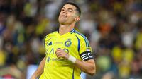 Dua golnya pada laga Al Nassr vs Damac membuat megabintang asal Portugal ini telah meraih 915 gol sepanjang kariernya dan tinggal sedikit lagi untuk mencapai angka 1.000 gol. (AFP/Fayez Nureldine)
