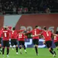 Pemain Georgia merayakan keberhasilan mereka untuk kali pertama ke Piala Eropa setelah menang atas Yunani lewat drama adu penalti dalam laga play-off Euro 2024 di Tbilisi, Rabu (27/3/2024) dini hari WIB. (Giorgi ARJEVANIDZE / AFP)