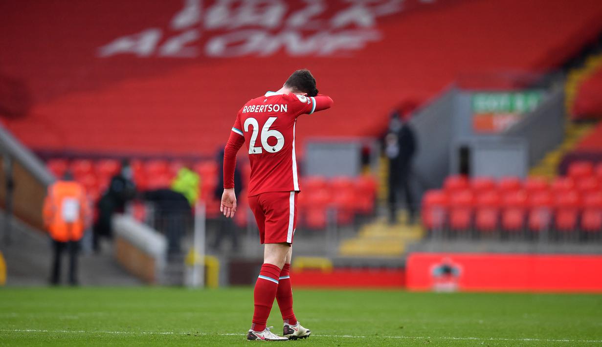 Reaksi pemain Liverpool, Andrew Robertson usai timnya dikalahkan Fulham dalam pertandingan lanjutan Liga Inggris. (Foto: AFP/Pool/Paul Ellis)