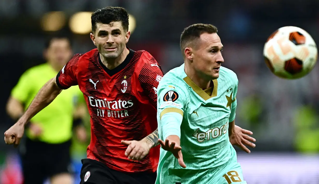 Bermain kandang, AC Milan sukses melumat SK Slavia Praha dengan skor 4-2. (GABRIEL BOUYS/AFP)