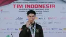 Atlet Wushu, Edgar Xavier Marvelo, berpose setelah acara penyambutan atlet SEA Games 2025 di Bandara Soekarno-Hatta, Tangerang, Selasa (16/12/2025). (Bola.com/M Iqbal Ichsan)