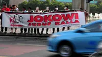 Relawan Jokowi-Jusuf Kalla melakukan aksi simpatik di Bundaran HI Jakarta, (17/10/14). (Liputan6.com/Johan Tallo)