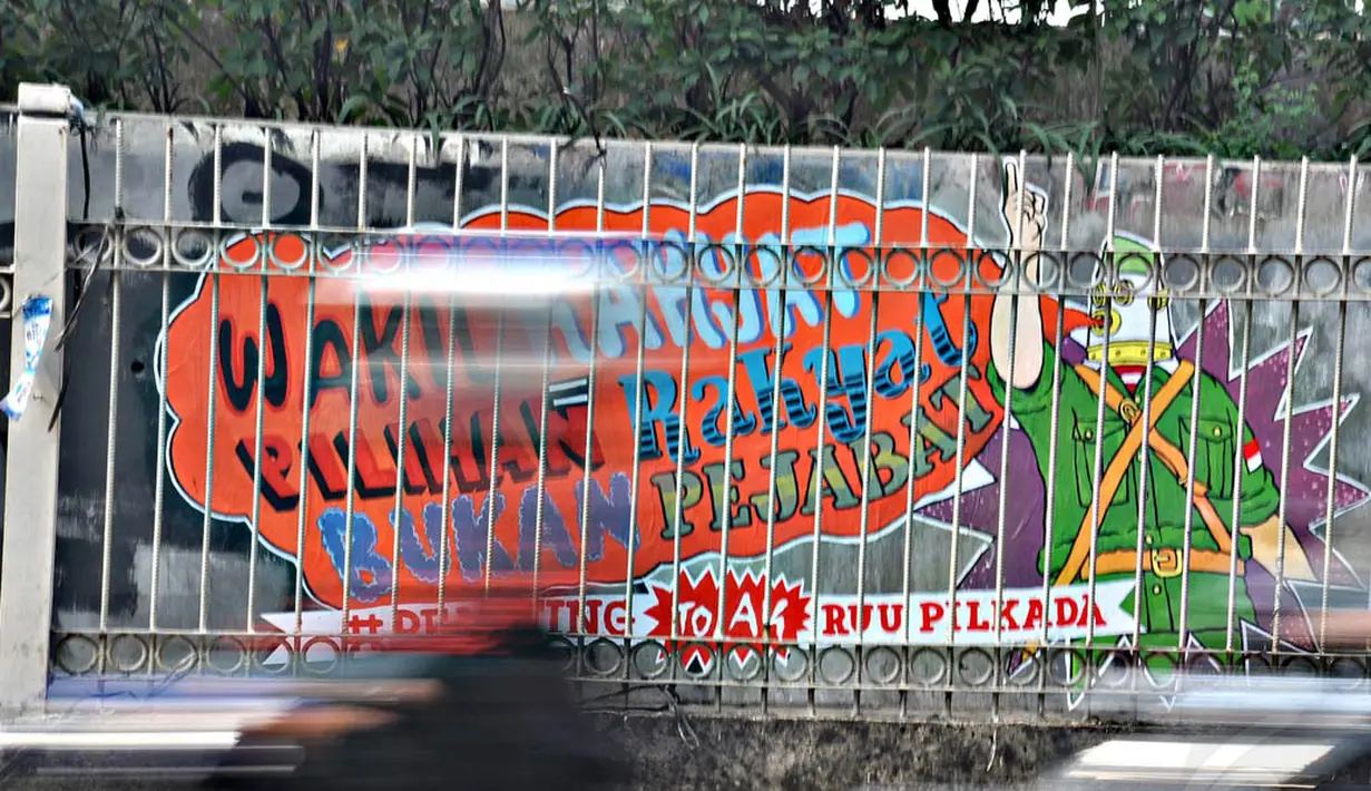 Mural tersebut berisi tentang aspirasi masyarakat yang menolak RUU Pilkada yang memilih Kepala Daerah lewat DPRD, Jakarta, (28/9/14). (Liputan6.com/Miftahul Hayat) 