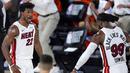 Pebasket Miami Heat, Jimmy Butler dan Jae Crowder melakukan selebrasi saat melawan Boston Celtics pada gim pertama final Wilayah Timur playoff NBA di SPN World of Sports Complex, Selasa (15/9/2020). Heat menang dengan skor 117-114. (AP/Mark J. Terrill)