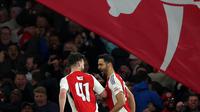 Lima menit berselang atau menit ke-75, sepakan first-time Mikel Merino mengoyak jala gawang Real Madrid. Arsenal unggul 3-0 atas Real Madrid. (Adrian Dennis/AFP)
