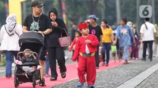 Warga mendatangi area perayaan Lebaran Betawi 2025 di lapangan Monumen Nasional (Monas), Jakarta, Sabtu (26/4/2025). (Liputan6.com/Angga Yuniar)
