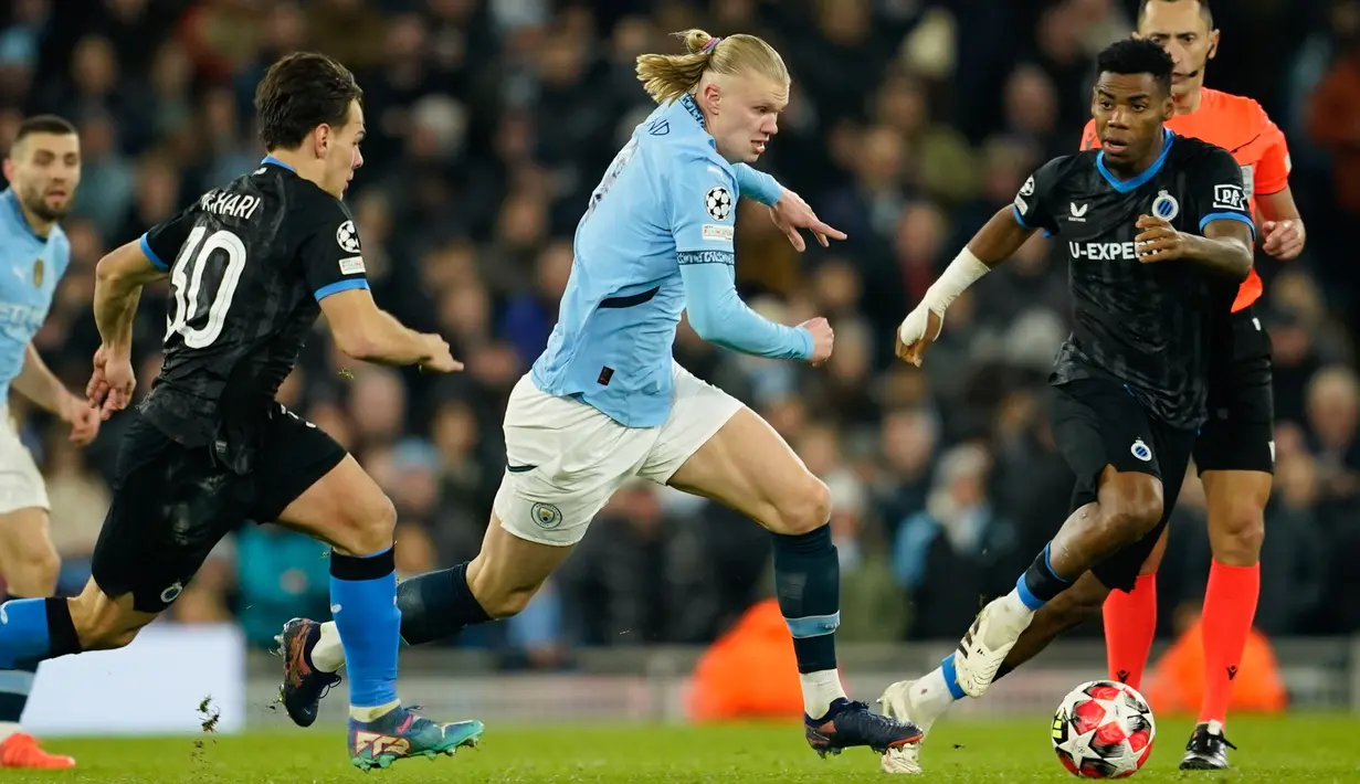 Manchester City sukses melaju ke babak play-off Liga Champions setelah mencatat kemenangan dramatis melawan Club Brugge di Etihad Stadium. City menang dengan skor 3-1. (AP Photo/Dave Thompson)