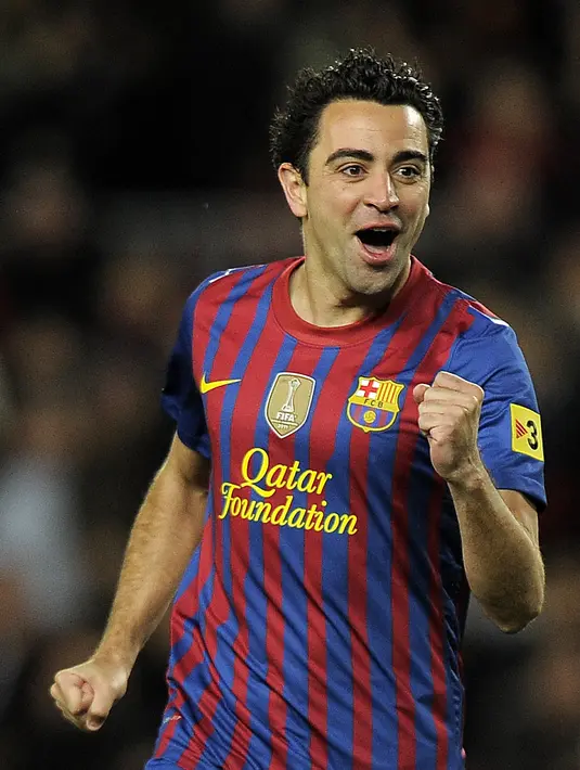 8. Xavi Hernandez - Dalam banyak hal, pemain yang sangat dicintai Bercelonista selalu melayani setiap rekan di setiap tim yang ia perkuat. Karena kalian tidak akan pernah melihat pemain dengan umpan lebih banyak dari Xavi. (AFP/Lluis Gene)