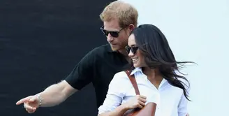 Hubungan Pangeran Harry dan Meghan Markle kini sedang ramai disorot publik. Selain soal penampilan pertamanya di depan umum saat hadir di Invictus Games, rencana pernikahan pun kian menyeruak. (AFP/Chris Jackson)