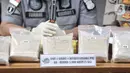 Barang bukti heroin ditunjukkan saat rilis pengungkapan kasus narkoba di Mapolda Metro Jaya, Jakarta, Kamis (12/12/2019). SH dibekuk  di kawasan Gunung Sahari dan menyita heroin seberat 5 kilogram yang disembunyikan di dalam dus susu bubuk. (merdeka.com/Iqbal S. Nugroho)