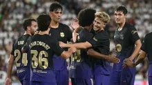 Penyerang Barcelona asal Jerman bernomor punggung 14, Karim Adeyemi, merayakan gol kedua timnya bersama gelandang Barcelona asal Spanyol bernomor punggung 7, Fermin Lopez, dalam pertandingan Liga Spanyol antara Elche CF dan FC Barcelona di Stadion Martinez Valero, Elche, pada 24 Agustus 2026. (JOSE JORDAN/AFP)
