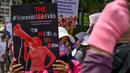 Aliansi Perempuan Indonesia menuntut negara segera menyelesaikan sejumlah kasus kekerasan terhadap perempuan yang selama ini terbengkalai. (BAY ISMOYO/AFP)