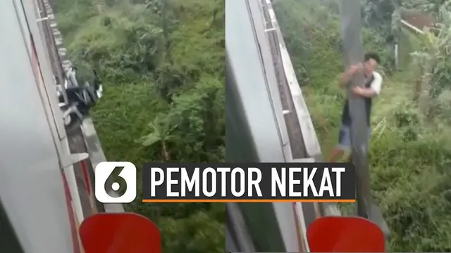 Beredar video seorang pria bergelantungan di tiang jembatan rel kereta api. Menurut kabar, pria tersebut nekat terobos jembatan rel kereta api dengan sepeda motornya.