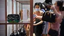 Para turis berbelanja di pusat perbelanjaan bebas pajak (duty free) di Kota Sanya, Provinsi Hainan, China selatan, pada 5 Oktober 2020. Hainan mencatatkan lonjakan penjualan produk bebas pajak selama liburan Hari Nasional dan Festival Pertengahan Musim Gugur. (Xinhua/Guo Cheng)