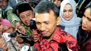 Gubernur nonaktif Sumut, Gatot Pujo Nugroho saat diiwawancarai wartawan di Pengadilan Tipikor Jakarta, (23/12).   Sidang beragendakan pembacaaan surat dakwaan oleh Jaksa Penuntut Umum kepada KPK. (Liputan6.com/Helmi Afandi)
