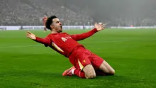 Pemain Liverpool, Curtis Jones merayakan golnya ke gawang Leicester pada laga lanjutan Liga Inggris 2024/2025 di Anfield, Liverpool, Inggris, Jumat (27/12/2024) WIB. (AFP/Paul Ellis)