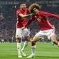 Marouane Fellaini rayakan gol ke gawang Celta Vigo (Miguel RIOPA / AFP)