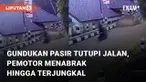 Gundukan pasir menutupi sebuah jalan mencelakai pemotor mengundang perhatian