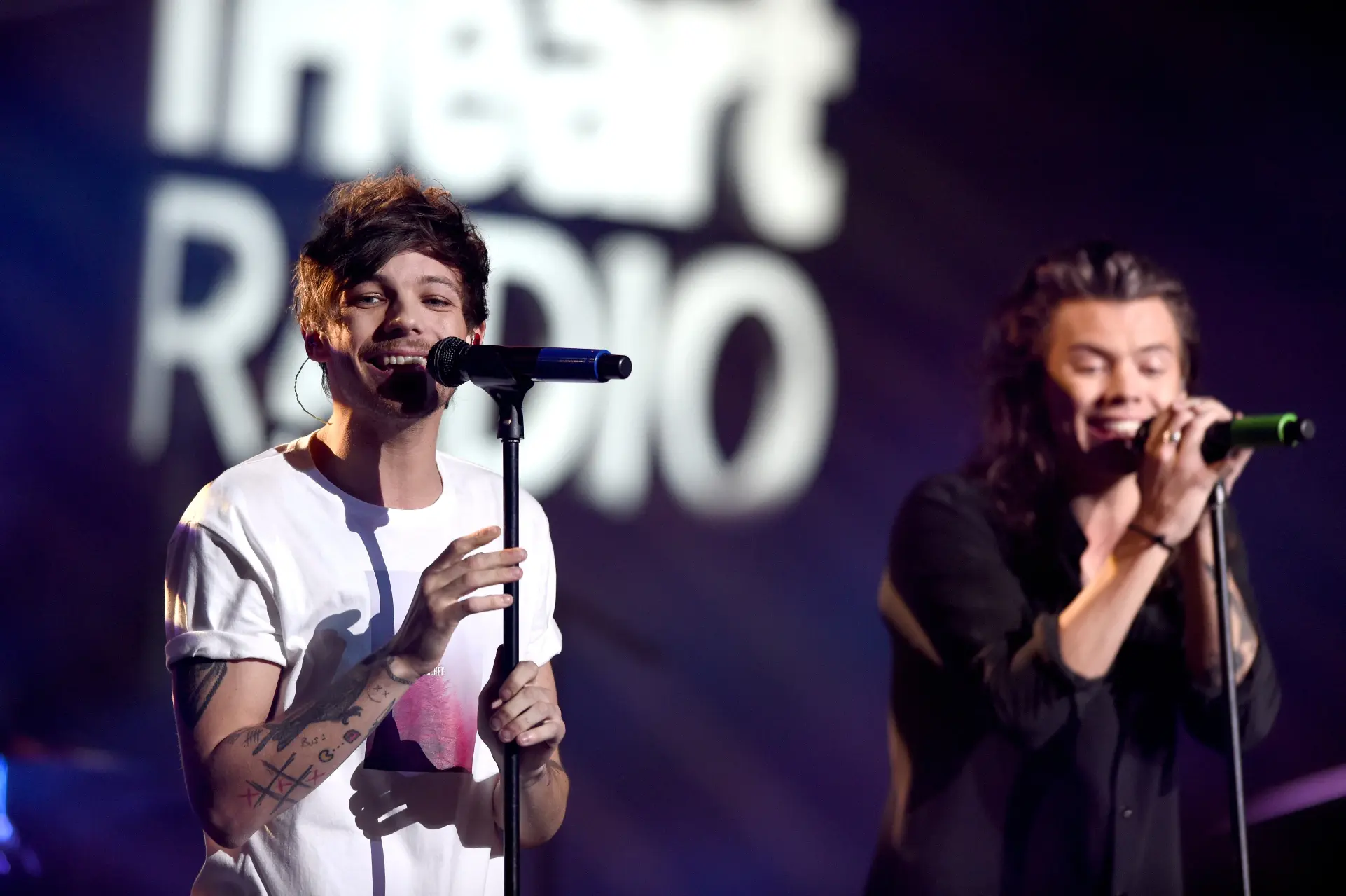 Louis Tomlinson dan Harry Styles (AFP/COOPER NEILL / GETTY IMAGES NORTH AMERICA)