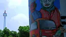 Salah satu hasil lukisan mural yang di festival bertema "Jakarta baru, Jakarta bersih", Sabtu (30/8/14). (Liputan6.com/Faisal R Syam) 