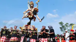 Dalam ajaran Hindu Dharma, Bhuta Kala merepresentasikan kekuatan (Bhu), alam semesta dan waktu (kala) yang tak terukur dan tak terbantahkan (Liputan6.com/Andrian M Tunay)