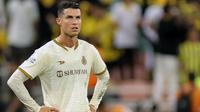Penyerang Al-Nassr Cristiano Ronaldo tampak kecewa dalam pertandingan Liga Arab Saudi melawan Al-Ittihad di Stadion King Abdullah Sport City, Jeddah, Jumat (10/3/2023) dini hari WIB. Al-Nassr kalah 0-1 dari Al-Ittihad. (AFP)