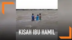 Untuk sampai ke puskesmas yang berada di desa seberang, ibu hamil ini harus berjuang keras melawan derasnya arus air sungai.