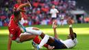 Striker Inggris, Marcus Rashford, dijatuhkan bek Bulgaria, Nikolay Bodurov, pada laga Kualifikasi Piala Eropa 2020 di Stadion Wembley, London, Sabtu (7/9). Inggris menang 4-0 atas Bulgaria. (AFP/Ben Stansall)