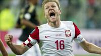 Selebrasi gol gelandang Polandia Jakub Blaszczykowski ke gawang Jerman di laga pemanasan jelang Euro 2012 yang berlangsung di Gdansk, 6 September 2011. Skor 2-2. AFP PHOTO / JOHN MACDOUGALL