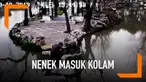 Seorang nenek dan cucunya terpeleset dan terjatuh ke dalam kolam teratai di China. Saat kejadian sang nenek tengah memapah cucunya.