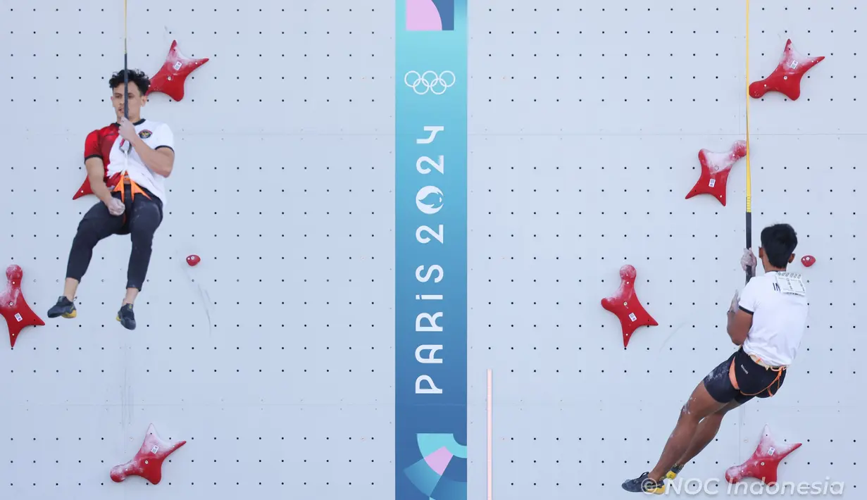 Atlet panjat tebing Indonesia, Veddriq Leonardo (kiri) berhasil mengungguli kompatriotnya, Rahmad Adi Mulyono  pada babak eliminasi cabor panjat tebing nomor speed putra Olimpiade Paris 2024 di Le Bourget Climbing Venue, Paris, Selasa (6/8/2024). (Dok. NOC Indonesia)