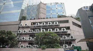 Suasana Gedung Kementerian Hukum dan Hak Asasi Manusia Republik Indonesia (Kemenkumham) seusai peristiwa kebakaran di Jalan Rasuna Said, Kuningan Jaksel, Kamis (8/12/2022). Gedung yang terbakar di area perkantoran Kemenkumham yakni lantai 5 Gedung Sentra Mulia. (Liputan6.com/Faizal Fanani)