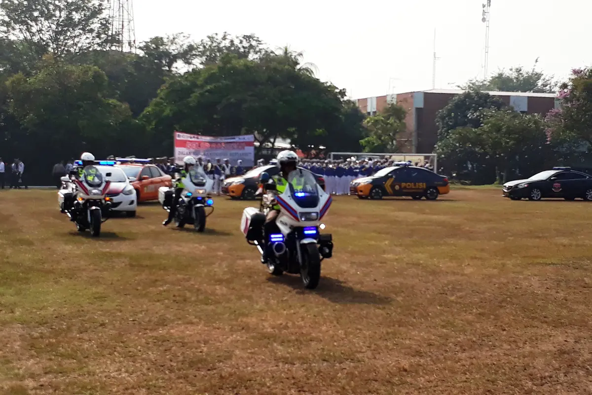 Jalannya gelar pasukan penyambutan kedatangan official dan atlet Asian Games 2018 di Bandara Internasional Soekarno Hatta, Kota Tangerang, Kamis (2/8/2018). (Liputan6.com/Pramita Tristiawati)