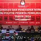 Suasana pengundian dan penetapan nomor urut partai politik peserta Pemilu 2024 di gedung KPU, Jakarta, Rabu (14/12/2022). Komisi Pemilihan Umum (KPU) menggelar acara pengundian dan penetapan nomor urut partai politik peserta Pemilu 2024. 17 partai politik yang lolos menjadi peserta Pemilu 2024 pun telah mendapatkan nomor urutnya masing-masing. (Liputan6.com/Herman Zakharia)