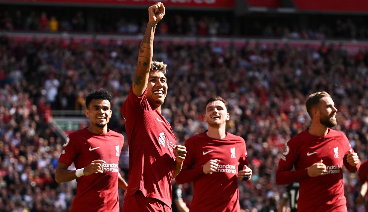 Selebrasi striker Liverpool, Roberto Firmino setelah mencetak gol ke gawang Bournemouth pada laga Liga Inggris 2022/2023 di Anfield Stadium, Liverpool (27/8/2022). Roberto Firmino yang dipastikan meninggalkan Liverpool pada musim depan, menjadi pemain pertama yang mencetak hattrick assist di Liga Inggris pada musim 2022/2023. Momen itu terjadi di pekan ke-4 saat Liverpool menang 9-0 atas Bournemouth. Dua gol juga dicetaknya dalam laga tersebut. (AFP/Oli Scarff)